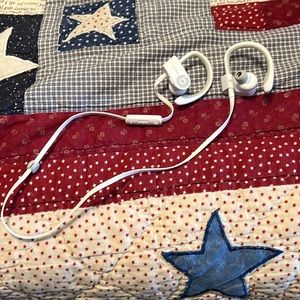 PowerBeats white headphones